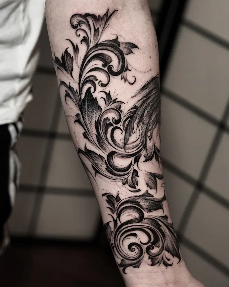blackwork tattoo filigree style on an arm